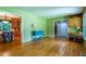 Spacious living room with hardwood floors leading to the dining area and stairs at 1831 Galilee Ct, Tucker, GA 30084
