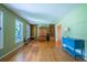 Bright and airy living room featuring hardwood floors, large windows, and custom built-ins at 1831 Galilee Ct, Tucker, GA 30084