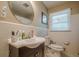 Small bathroom featuring a vanity with sink, a toilet, tiled walls, and a medicine cabinet at 2194 Freydale Se Rd, Marietta, GA 30067