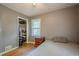 This is a modest bedroom featuring a closet, window and hardwood floors at 2194 Freydale Se Rd, Marietta, GA 30067