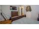 Bedroom with hardwood floors, mounted television, dresser, and view of closet door at 2194 Freydale Se Rd, Marietta, GA 30067