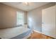 Simple bedroom featuring a full bed, hardwood floors, a window, and a closet at 2194 Freydale Se Rd, Marietta, GA 30067