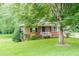 Quaint brick home with lovely front yard and mature trees offering plenty of shade at 2194 Freydale Se Rd, Marietta, GA 30067