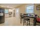 Well-lit kitchen area with view of a laundry room, casual table, and stainless steel appliances at 2194 Freydale Se Rd, Marietta, GA 30067
