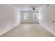 A bedroom featuring neutral carpet, a window, and a ceiling fan at 3559 Turtle Cove Se Ct, Marietta, GA 30067