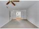 Spacious bedroom with a ceiling fan and an open doorway to an adjoining bathroom at 3559 Turtle Cove Se Ct, Marietta, GA 30067