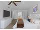 Bright primary bedroom boasts a king-sized bed, en-suite bathroom, and ample closet space at 3559 Turtle Cove Se Ct, Marietta, GA 30067
