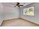 Bright bedroom with neutral carpet, ceiling fan, and windows allowing for lots of natural light at 3559 Turtle Cove Se Ct, Marietta, GA 30067