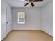 A comfortable bedroom featuring a window with natural light and a ceiling fan at 3559 Turtle Cove Se Ct, Marietta, GA 30067