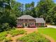 Beautiful two-story brick home with black shutters and lovely landscaping at 3559 Turtle Cove Se Ct, Marietta, GA 30067