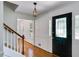 Bright foyer with hardwood floors, decorative glass front door, and staircase enhancing the home's welcome at 3559 Turtle Cove Se Ct, Marietta, GA 30067