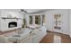 Comfortable living room with a brick fireplace, bay windows, hardwood floors, and lots of natural light at 3559 Turtle Cove Se Ct, Marietta, GA 30067