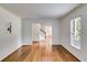 Bright living room with hardwood floors, large windows, and crown molding detail showcases an inviting space at 3559 Turtle Cove Se Ct, Marietta, GA 30067