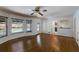 Sunlit living room boasts hardwood floors and views of the outdoor pool through large windows at 3559 Turtle Cove Se Ct, Marietta, GA 30067