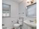 Stylish powder room featuring beadboard paneling and a pedestal sink at 3559 Turtle Cove Se Ct, Marietta, GA 30067