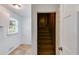Inviting staircase with carpeted steps, leads to the upper level of the home at 3559 Turtle Cove Se Ct, Marietta, GA 30067