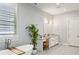 Bathroom boasts a soaking tub, double vanity, white cabinetry, and plantation shutters at 2020 Bixby Se St, Atlanta, GA 30317