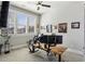 Bright home office featuring a ceiling fan, a large window, and a wooden desk at 2020 Bixby Se St, Atlanta, GA 30317