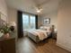 Cozy bedroom showcasing a comfortable bed, a dresser with a lamp, and natural light from a window at 962 Bibbs Nw Cir # 8, Atlanta, GA 30318