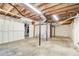 Large unfinished basement with concrete floor and support beams at 1834 Buckeye Sw St, Atlanta, GA 30310