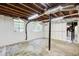 Unfinished basement with bright lighting and white-painted walls and ceiling at 1834 Buckeye Sw St, Atlanta, GA 30310