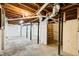 Unfinished basement with exposed beams and concrete flooring at 1834 Buckeye Sw St, Atlanta, GA 30310