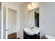 Updated bathroom featuring a stylish vanity, mirror, and modern fixtures at 1834 Buckeye Sw St, Atlanta, GA 30310