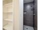 Tiled shower stall with shelving and modern fixtures at 1834 Buckeye Sw St, Atlanta, GA 30310