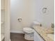 Cozy bathroom with tile flooring, toilet, and a granite countertop sink at 1834 Buckeye Sw St, Atlanta, GA 30310
