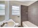 Modern bathroom featuring updated tiles, a bathtub and sleek fixtures at 1834 Buckeye Sw St, Atlanta, GA 30310
