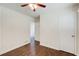Comfortable bedroom with ceiling fan, hardwood floors, and a spacious closet at 1834 Buckeye Sw St, Atlanta, GA 30310