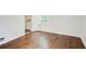 Bright bedroom features hardwood floors, white walls, and natural light from the window at 1834 Buckeye Sw St, Atlanta, GA 30310