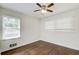 Bedroom with hardwood floors, bright natural light, and a modern ceiling fan at 1834 Buckeye Sw St, Atlanta, GA 30310