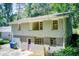 Exterior back view of the home, showing basement access and two story construction at 1834 Buckeye Sw St, Atlanta, GA 30310