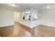 Open concept living room featuring hardwood floors, white trim, and kitchen counter pass-through at 1834 Buckeye Sw St, Atlanta, GA 30310