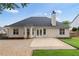 Rear exterior showcasing a patio area, well-maintained siding, and a fenced yard, ideal for outdoor living and entertaining at 3549 Daventry Nw Ln, Kennesaw, GA 30144