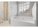 Bright bathroom with a standalone soaking tub and a separate shower enclosure at 3549 Daventry Nw Ln, Kennesaw, GA 30144