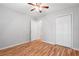 Bedroom features hardwood floors, a ceiling fan, and a closet at 3549 Daventry Nw Ln, Kennesaw, GA 30144