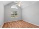 Bedroom with high ceilings, hardwood floors, ceiling fan and bright window at 3549 Daventry Nw Ln, Kennesaw, GA 30144