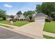 Inviting single-Gathering home with a well-kept lawn, combination brick and siding exterior, and an attached two-car garage and driveway at 3549 Daventry Nw Ln, Kennesaw, GA 30144