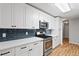 Bright kitchen features quartz countertops, stainless steel appliances, and modern backsplash at 3549 Daventry Nw Ln, Kennesaw, GA 30144