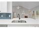 Bright kitchen features quartz countertops, stainless steel appliances, and an open view to the living room at 3549 Daventry Nw Ln, Kennesaw, GA 30144