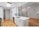 Modern kitchen features quartz countertops, stainless steel appliances, hardwood floors, and open concept design at 3549 Daventry Nw Ln, Kennesaw, GA 30144