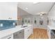 Well-lit kitchen with white countertops, stainless steel appliances, and stylish backsplash at 3549 Daventry Nw Ln, Kennesaw, GA 30144