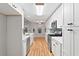 Modern kitchen features white cabinets, stainless steel appliances, and an adjacent breakfast nook with natural light at 3549 Daventry Nw Ln, Kennesaw, GA 30144