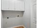Functional laundry area with upper cabinets, providing ample storage space at 3549 Daventry Nw Ln, Kennesaw, GA 30144