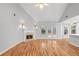 Bright living room features a fireplace, hardwood floors, and large sliding glass doors at 3549 Daventry Nw Ln, Kennesaw, GA 30144