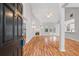 Bright living room with fireplace, vaulted ceilings, hardwood floors and French doors at 3549 Daventry Nw Ln, Kennesaw, GA 30144