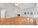 Light-filled living room features fireplace, ceiling fan, and hardwood floors at 3549 Daventry Nw Ln, Kennesaw, GA 30144