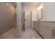 Bright bathroom featuring a spacious shower with tile surround, glass door, and a double vanity at 606 Goldsmith Ct # 114, Johns Creek, GA 30022